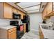 The kitchen features wooden cabinets and appliances at 2146 W Isabella Ave # 215, Mesa, AZ 85202
