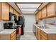 The kitchen features wooden cabinets and appliances at 2146 W Isabella Ave # 215, Mesa, AZ 85202