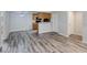 Open-concept living and kitchen area with wood flooring throughout the living space at 2146 W Isabella Ave # 215, Mesa, AZ 85202