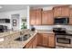 Well-equipped kitchen with stainless steel appliances and granite countertops at 26787 W Mohawk Ln, Buckeye, AZ 85396