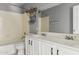 Bathroom featuring double sinks, tub, and neutral color palette at 30663 N 44Th St, Cave Creek, AZ 85331