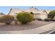 Charming single-story home with low maintenance desert landscaping, a tile roof and an attached two-car garage at 30663 N 44Th St, Cave Creek, AZ 85331