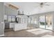 Modern kitchen with stainless steel appliances, white cabinets, and a breakfast bar at 30663 N 44Th St, Cave Creek, AZ 85331