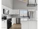 Kitchen with white cabinets, stainless steel appliances and island at 30663 N 44Th St, Cave Creek, AZ 85331