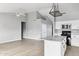 Bright kitchen showcasing white cabinets, an island, and stainless steel appliances at 30663 N 44Th St, Cave Creek, AZ 85331