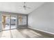 Bright living room with sliding glass doors to the pool area and wood flooring at 30663 N 44Th St, Cave Creek, AZ 85331