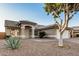 Charming single-story home featuring a tile roof, desert landscaping, and a neutral-colored facade at 3536 N Arabella --, Mesa, AZ 85215