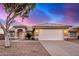 Charming single-story home featuring a well-manicured front yard with desert landscaping and a two-car garage at 3536 N Arabella --, Mesa, AZ 85215