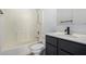 Bathroom features a shower-tub combo and dark cabinets with a white countertop at 3618 S Weaver Cir, Gilbert, AZ 85297