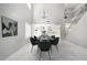 Dining room with soaring ceilings, neutral walls, marble floors, modern chandelier, and staircase at 3618 S Weaver Cir, Gilbert, AZ 85297