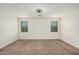 Bedroom featuring neutral carpet flooring and windows with venetian blinds at 3650 E Sinclair St, Phoenix, AZ 85050