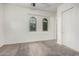 Bedroom features neutral carpet flooring and arched windows at 3650 E Sinclair St, Phoenix, AZ 85050