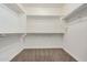 Walk-in closet with carpet flooring and white shelving at 3650 E Sinclair St, Phoenix, AZ 85050