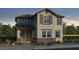 Charming two-story home with neutral stucco, shuttered windows, covered porch, and desert landscaping at 3755 N 99Th Dr, Avondale, AZ 85392