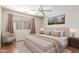 Comfortable bedroom featuring hardwood floors, a ceiling fan, and neutral decor at 408 E Silverwood Dr, Phoenix, AZ 85048