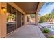 Relaxing covered patio with ceiling and wall lights, providing an ideal space for outdoor enjoyment at 408 E Silverwood Dr, Phoenix, AZ 85048