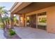 Spacious covered patio with a ceiling fan offers a cool retreat with direct access to the backyard pool area at 408 E Silverwood Dr, Phoenix, AZ 85048