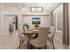 Light-filled dining area features modern chandelier, seating for six, and neutral decor at 408 E Silverwood Dr, Phoenix, AZ 85048