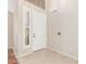 Bright foyer featuring tile flooring, and a white door with sidelight at 408 E Silverwood Dr, Phoenix, AZ 85048