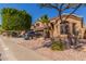 Charming home featuring manicured landscaping, a spacious driveway, and a three-car garage at 408 E Silverwood Dr, Phoenix, AZ 85048