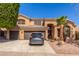 Inviting two-story home with a well-manicured front yard and a three-car garage at 408 E Silverwood Dr, Phoenix, AZ 85048