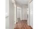 Hallway with white trim, neutral paint, and wood-look tile flooring at 408 E Silverwood Dr, Phoenix, AZ 85048