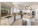 Kitchen with white cabinets, stainless steel appliances, granite countertops, and a view to the yard at 408 E Silverwood Dr, Phoenix, AZ 85048