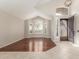 Inviting living room with hardwood floors, natural light, and decorative iron front door at 408 E Silverwood Dr, Phoenix, AZ 85048
