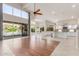 Open-concept living room offering views of the kitchen, pool, and backyard at 408 E Silverwood Dr, Phoenix, AZ 85048