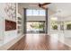 Light-filled living room with built-in storage, high ceilings, and backyard views at 408 E Silverwood Dr, Phoenix, AZ 85048