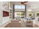 Bright living area showcases neutral furniture, large windows, and open floor plan at 408 E Silverwood Dr, Phoenix, AZ 85048