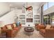 Cozy living space features custom built-ins, fan, and comfortable leather furniture at 408 E Silverwood Dr, Phoenix, AZ 85048
