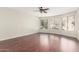 Spacious living room featuring beautiful hardwood floors and bright windows providing ample natural light at 408 E Silverwood Dr, Phoenix, AZ 85048