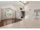 Bright living room featuring tile and wood flooring, soaring ceilings, and large windows at 408 E Silverwood Dr, Phoenix, AZ 85048