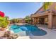 Private backyard pool with mature landscaping and patio area for entertaining or relaxation at 408 E Silverwood Dr, Phoenix, AZ 85048