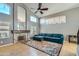 Bright and airy living room with a vaulted ceiling, decorative fireplace, and comfortable blue sofa at 4702 E Lavender Ln, Phoenix, AZ 85044