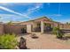 Outdoor covered patio features an outdoor dining area, BBQ and a lush tropical landscape at 502 E Mountain View Rd, San Tan Valley, AZ 85143