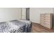 Bedroom with hardwood floors, shuttered windows and a animal print blanket on the bed at 502 E Mountain View Rd, San Tan Valley, AZ 85143