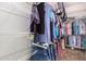 Walk-in closet with wire shelving fully stocked with clothing on hangers and shelves at 502 E Mountain View Rd, San Tan Valley, AZ 85143
