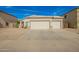 Exterior featuring a three car garage, desert landscaping and blue sky at 502 E Mountain View Rd, San Tan Valley, AZ 85143