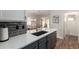 Modern kitchen featuring a quartz countertop island and stainless steel appliances at 502 E Mountain View Rd, San Tan Valley, AZ 85143
