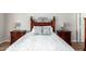 Close up of the bed in the main bedroom featuring floral pillows and white bedding at 502 E Mountain View Rd, San Tan Valley, AZ 85143