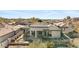 An aerial view showcasing the backyard, pool, and surrounding neighborhood at 6426 N 27Th St, Phoenix, AZ 85016