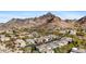 Aerial shot showcasing the community homes nestled amidst desert landscape with mountain backdrop at 6426 N 27Th St, Phoenix, AZ 85016