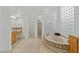 Well-lit bathroom with a tub, separate shower, and neutral decor at 6426 N 27Th St, Phoenix, AZ 85016