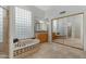 Bright bathroom with a large soaking tub, decorative tile, and dual vanities at 6426 N 27Th St, Phoenix, AZ 85016