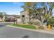 Well-kept yard of this home, showcasing stone details, green lawn, and mature trees at 6426 N 27Th St, Phoenix, AZ 85016