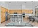 Bright kitchen boasts stainless steel appliances, wood cabinets, and counter seating at 6426 N 27Th St, Phoenix, AZ 85016