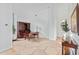 Bright living space with stone floors, wooden desk and cabinets, and minimalist decor at 6426 N 27Th St, Phoenix, AZ 85016