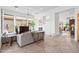 Spacious living room with white walls, stone floors, fireplace, and comfortable seating at 6426 N 27Th St, Phoenix, AZ 85016